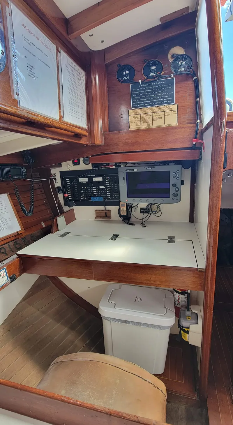Slide: The Image of Navigation area with wooden fittings and electronic equipment. - 23