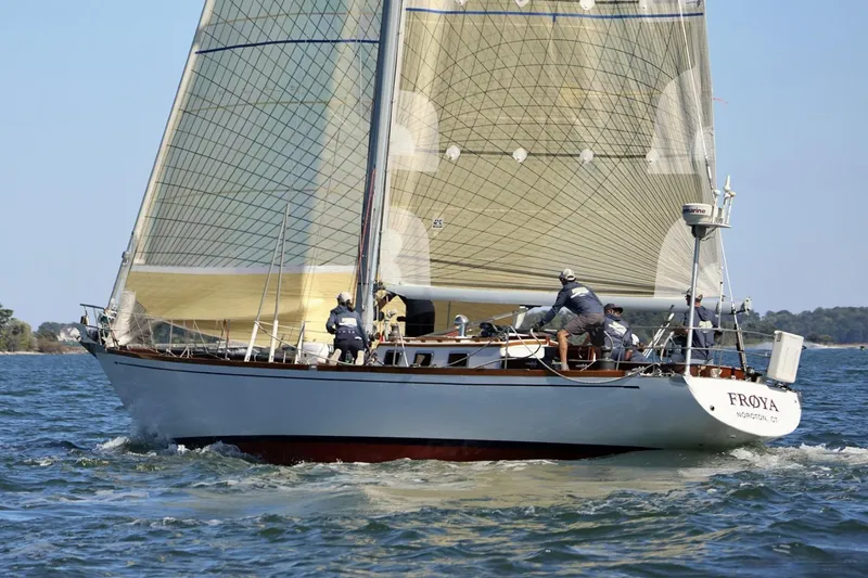 Slide: The Image of 1971 Frans Maas McCurdy & Rhodes 46 sailboat navigating waters with crew on deck. - 7