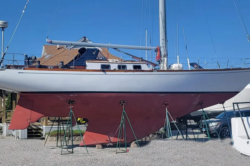 Slide: The Image of 1971 Frans Maas McCurdy & Rhodes 46 sailboat on stands, displayed outdoors. - 39