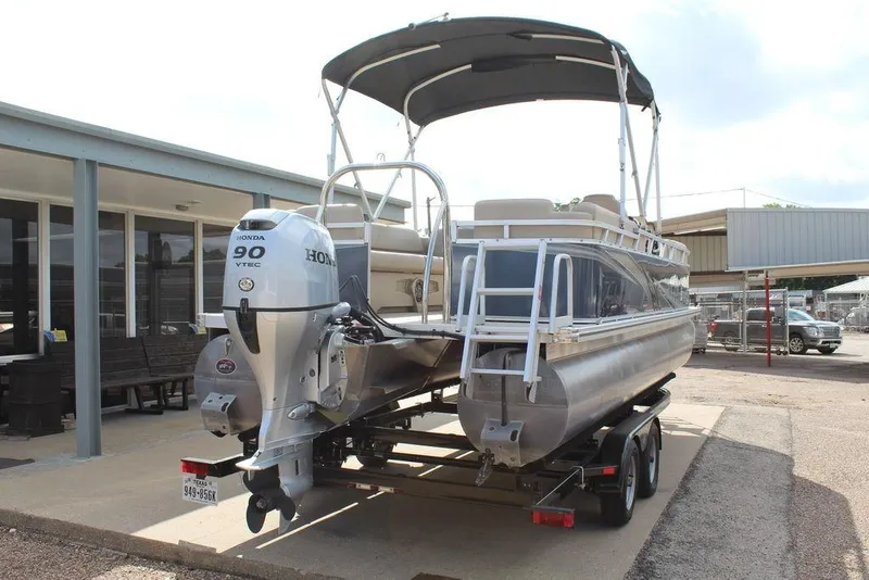 Slide: The Image of 2021 Avalon VLS Quad Lounge 22 FT pontoon boat with Honda 90 VTEC engine. - 4