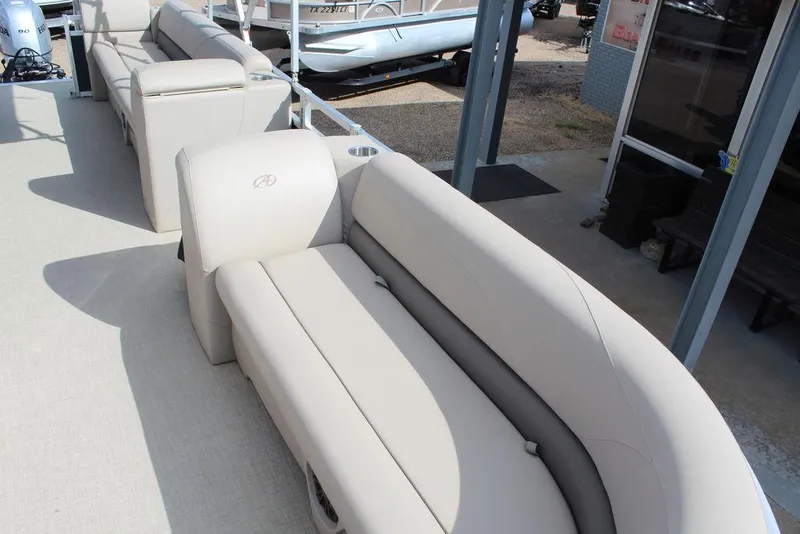 Slide: The Image of 2021 Avalon VLS Quad Lounge 22 FT with beige seating, showcasing luxurious boat interior. - 9