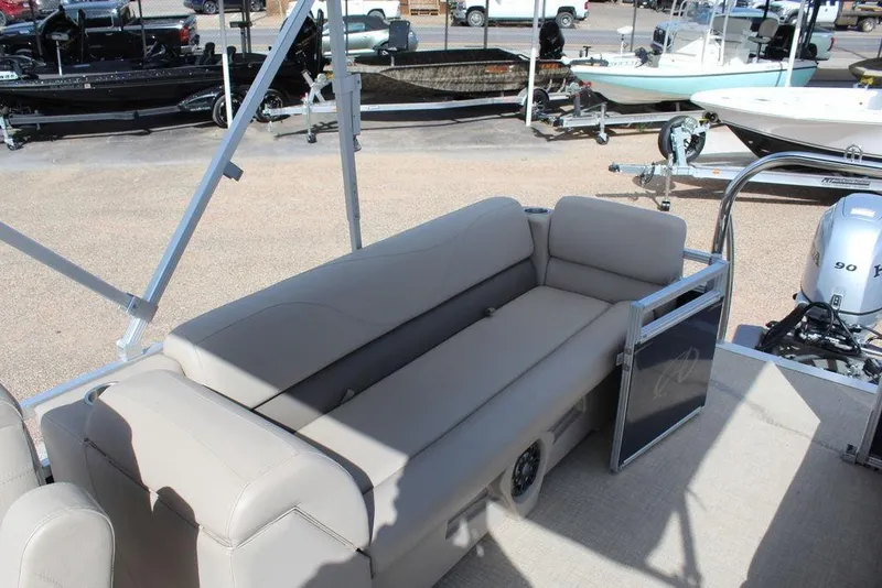 Slide: The Image of 2021 Avalon VLS Quad Lounge 22 FT pontoon boat interior with beige seating. - 14