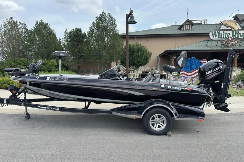 The Image of 2018 Ranger Z518 boat with Mercury engine on trailer, parked near White River Fly Shop. - 0