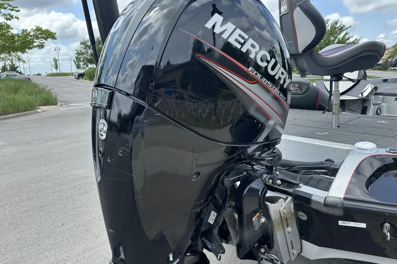 Slide: The Image of 2018 Ranger Z518 boat with Mercury FourStroke engine in a parking lot. - 10