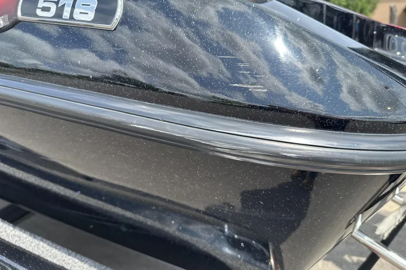 Slide: The Image of 2018 Ranger Z518 boat hull with reflective black finish and model badge. - 5