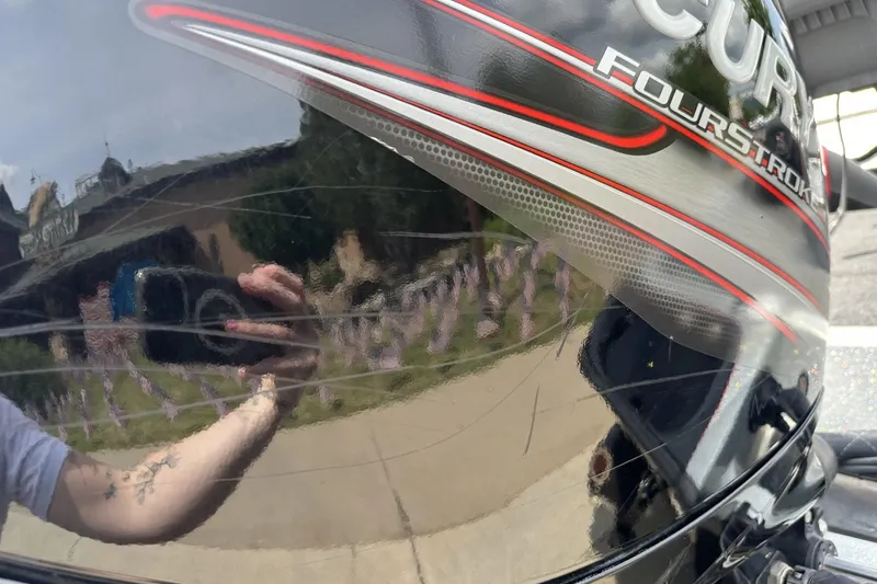 Slide: The Image of Reflection on a 2018 Ranger Z518 boat's glossy surface with visible branding. - 11