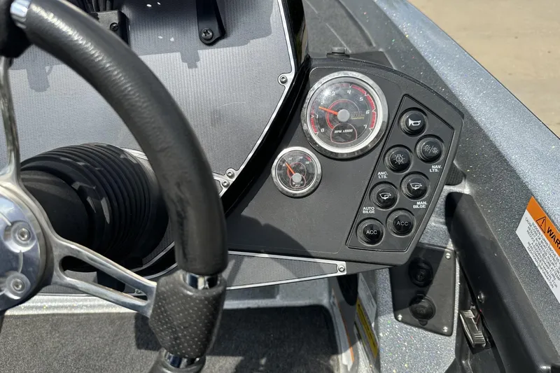 Slide: The Image of Dashboard of a 2018 Ranger Z518 boat with steering wheel and control panel. - 23