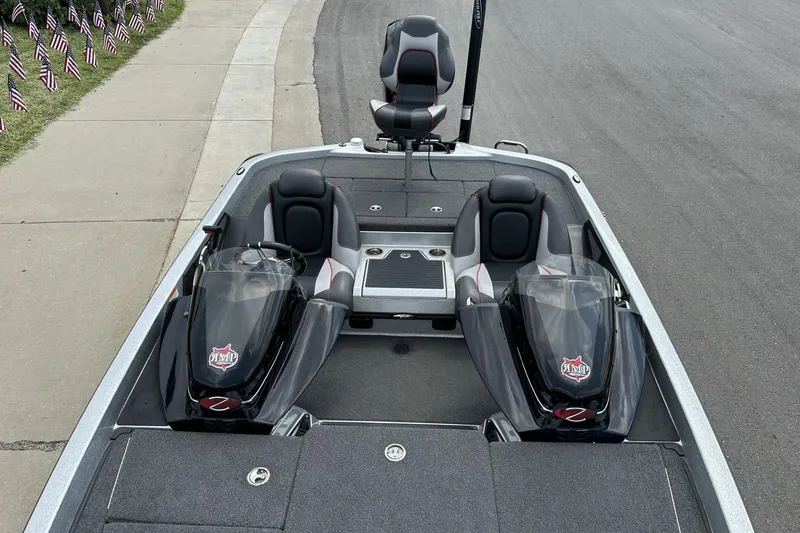 Slide: The Image of 2018 Ranger Z518 boat interior with dual seats and sleek design on a road. - 27