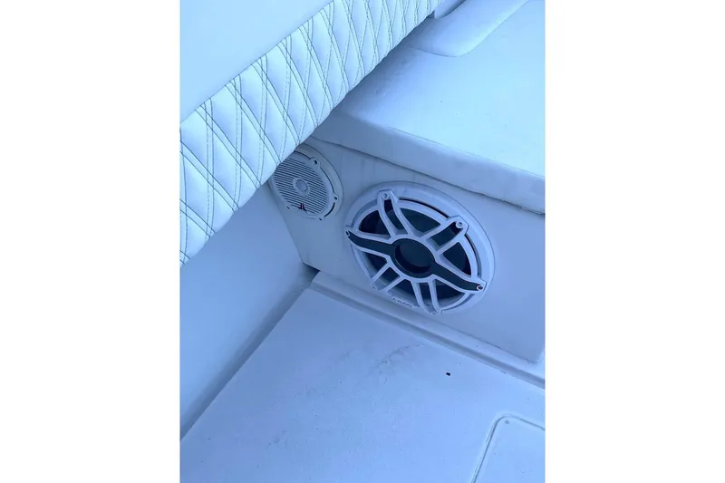 Slide: The Image of Speaker system on a 2002 Intrepid 323 Cuddy boat with cushioned seating. - 10