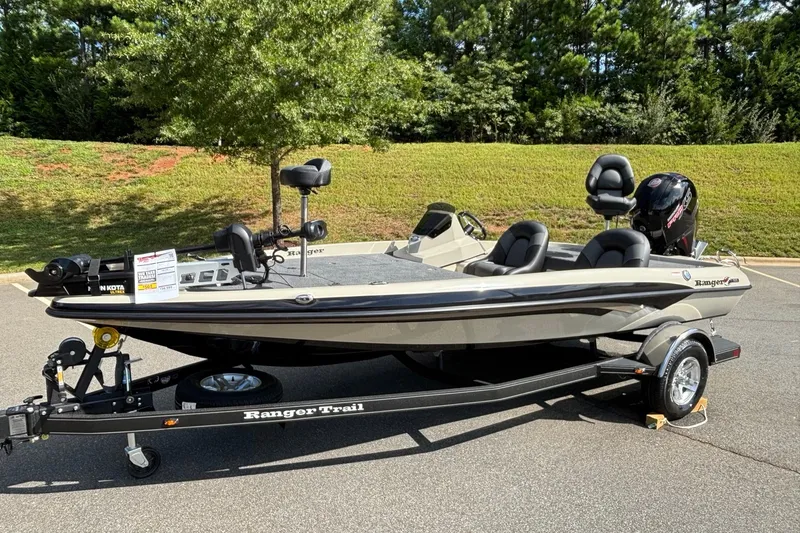 Slide: The Image of 2026 Ranger Z185 boat on trailer, parked outdoors, featuring sleek design and modern equipment. - 2