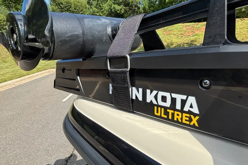 Slide: The Image of Minn Kota Ultrex motor on 2026 Ranger Z185 boat, parked on asphalt. - 8