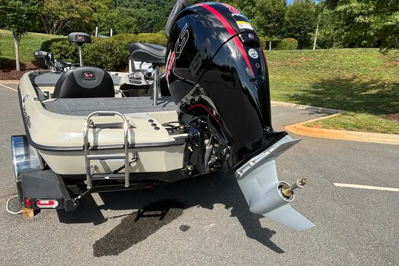 Slide: The Image of 2026 Ranger Z185 boat with powerful outboard motor, parked on a sunny day. - 100
