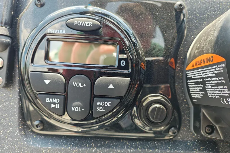 Slide: The Image of Control panel of a 2026 Tracker Targa V-19 Combo boat with audio system. - 16