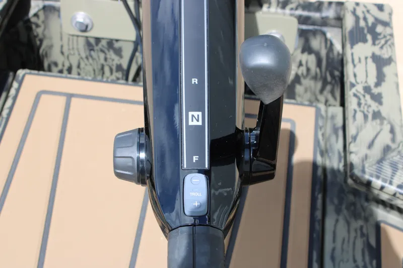Slide: The Image of Close-up of 2026 Tracker Grizzly 1650 T Prairie Wings Edition boat throttle control. - 7