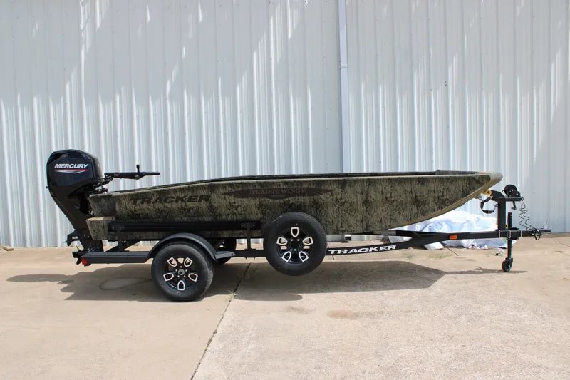 The Image of 2026 Tracker Grizzly 1650 T Prairie Wings Edition boat with Mercury engine on trailer. - 0