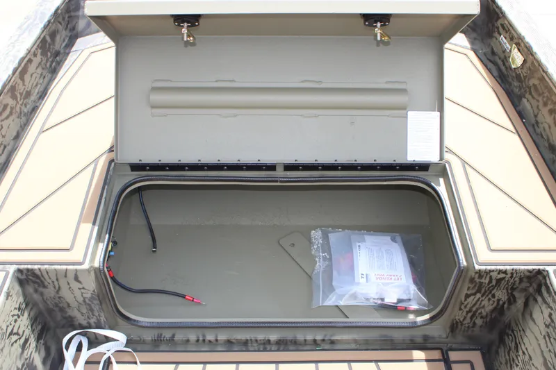 Slide: The Image of Open storage compartment of 2026 Tracker Grizzly 1650 T Prairie Wings Edition boat. - 8