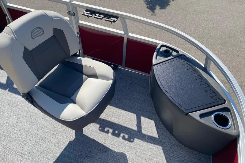 Slide: The Image of 2026 Sun Tracker Bass Buggy 18 DLX boat interior with seating and storage compartment. - 3