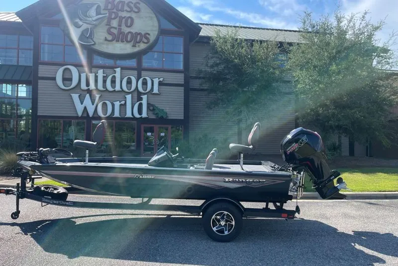 Slide: The Image of 2026 Ranger RT188P boat parked outside Bass Pro Shops Outdoor World. - 10