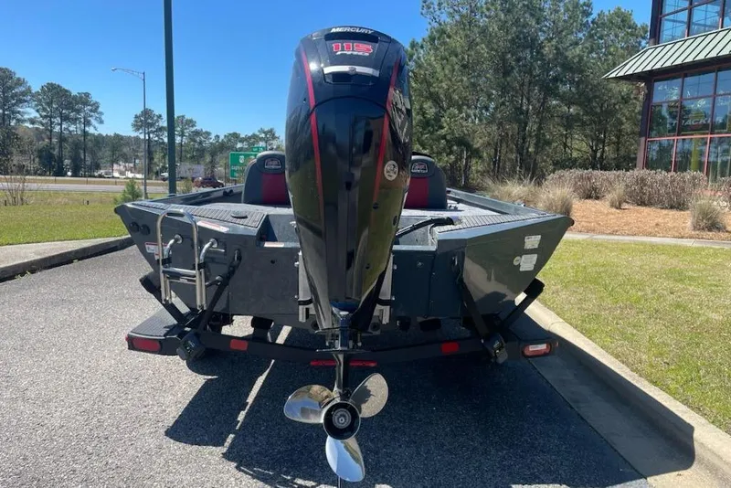 Slide: The Image of 2026 Ranger RT188P boat with Mercury 115 engine, parked outdoors. - 4