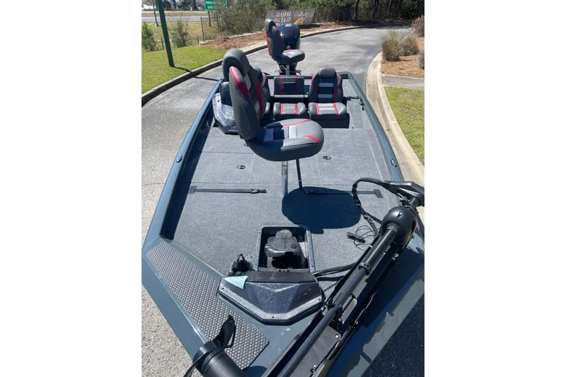 Slide: The Image of 2026 Ranger RT188P fishing boat with seating and trolling motor on a sunny day. - 6