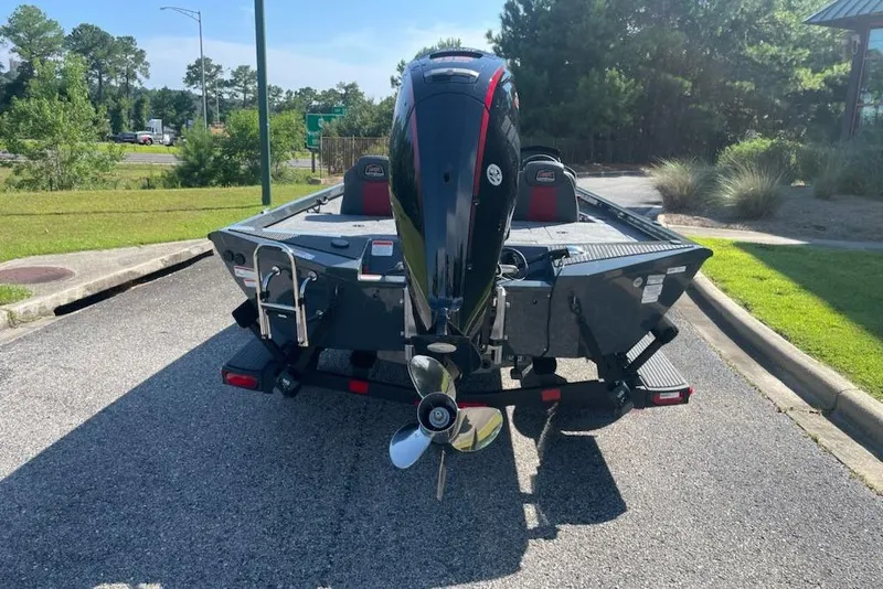 Slide: The Image of 2026 Ranger RT188P boat with outboard motor on a sunny day. - 1