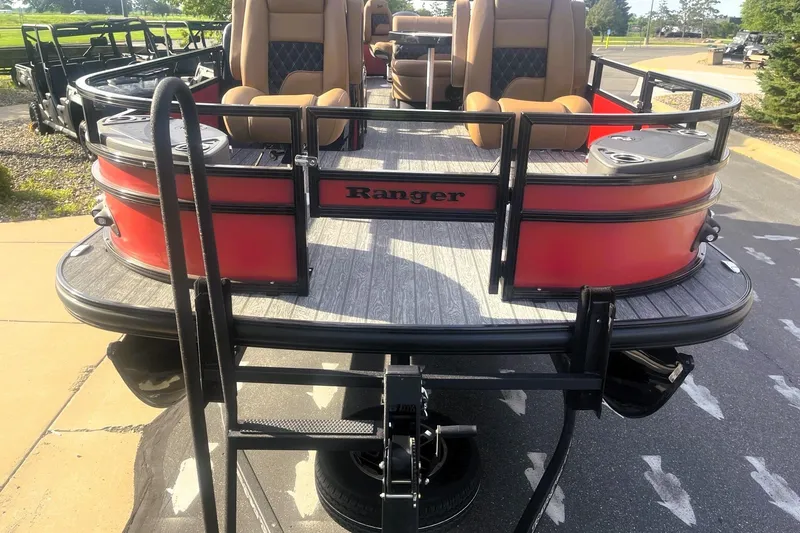Slide: The Image of 2026 Ranger 220F pontoon boat with red exterior and comfortable seating. - 4