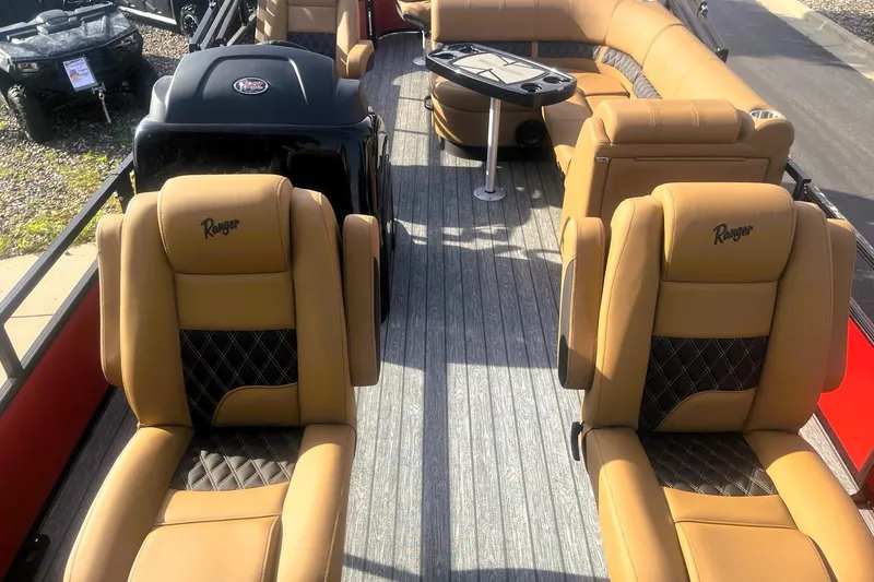 Slide: The Image of Luxurious 2026 Ranger 220F boat interior with tan leather seating and modern design. - 5
