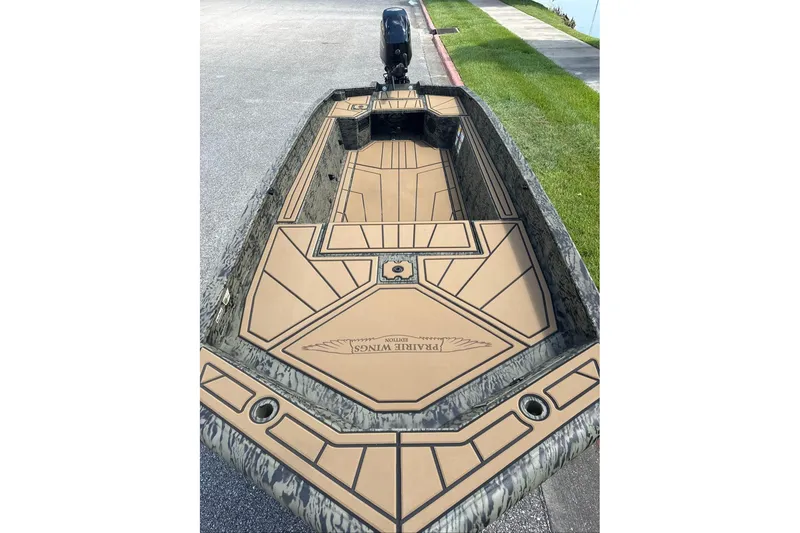 Slide: The Image of 2026 Tracker Grizzly 1650 T Prairie Wings Edition boat with custom deck design. - 4