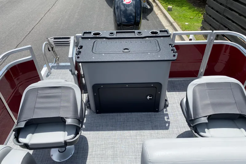 Slide: The Image of 2026 Sun Tracker SportFish 20 DLX boat interior with seating and storage area. - 6