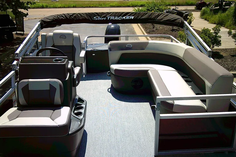 Slide: The Image of 2026 Sun Tracker Bass Buggy 18 DLX pontoon boat with spacious seating and modern design. - 2