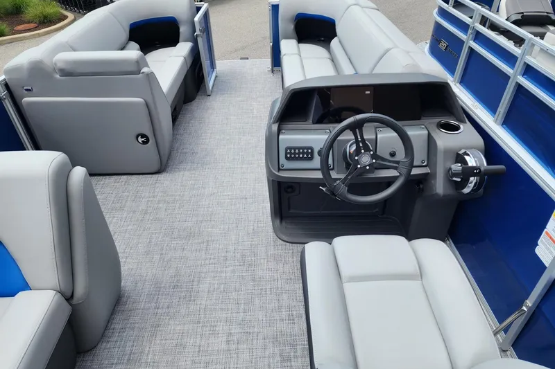Slide: The Image of 2026 Sun Tracker Party Barge 20 DLX interior with steering console and seating. - 3