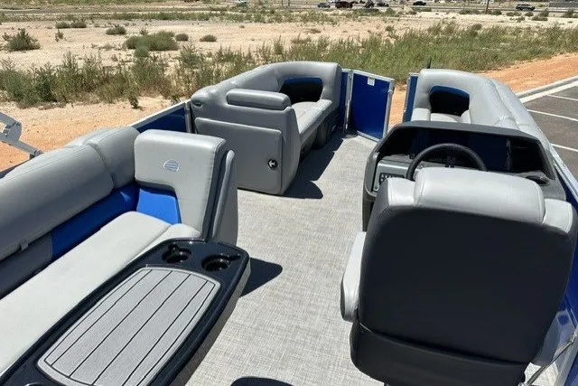 Slide: The Image of The image shows the interior of a 2026 Sun Tracker Party Barge 20 DLX with gray seating. - 15