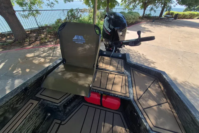 Slide: The Image of 2026 Tracker Grizzly 1650 T Prairie Wings Edition boat with Mercury motor and Millennium Marine seat. - 10