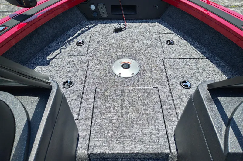 Slide: The Image of Interior view of 2026 Tracker Targa V-19 WT boat, featuring spacious carpeted deck. - 15