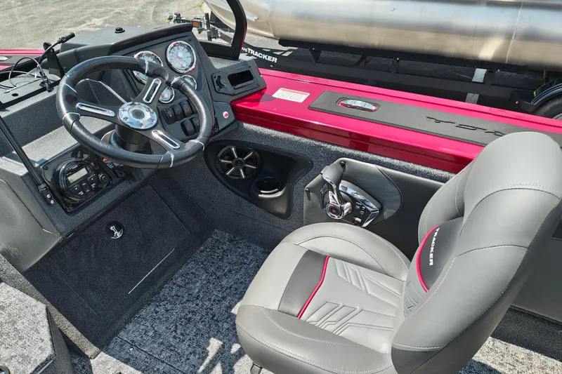 Slide: The Image of Interior of 2026 Tracker Targa V-19 WT boat with steering wheel and control panel. - 11