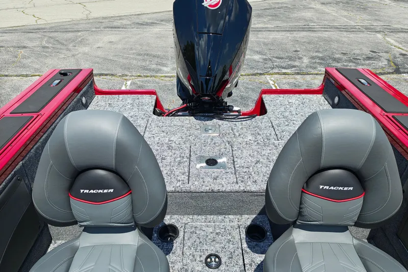 Slide: The Image of 2026 Tracker Targa V-19 WT boat interior with gray seats and motor. - 4
