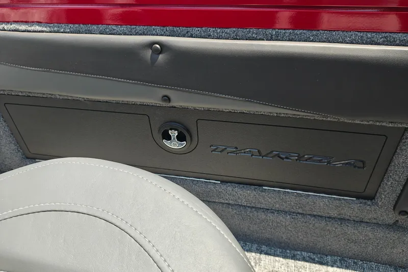 Slide: The Image of 2026 Tracker Targa V-19 WT interior detail with storage compartment and sleek design. - 8
