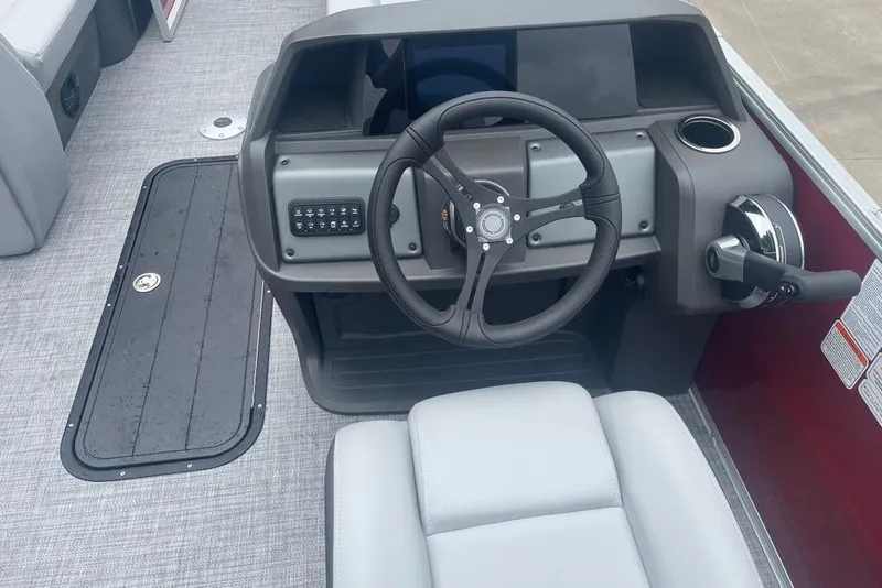 Slide: The Image of Steering console of 2026 Sun Tracker Party Barge 22 XP3 pontoon boat. - 2
