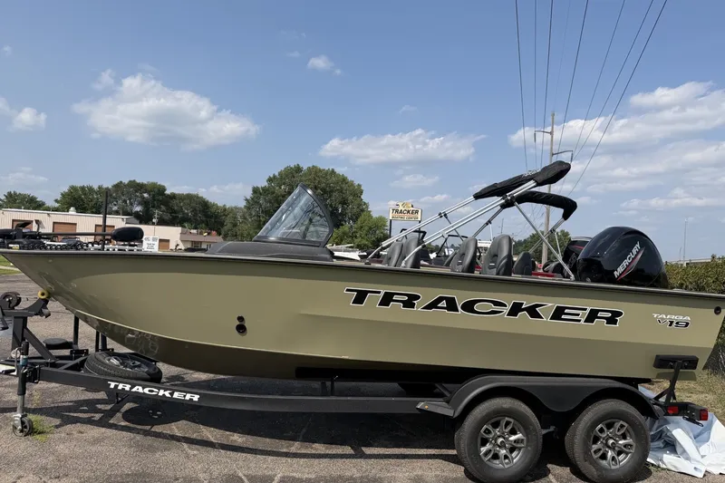 The Image of 2026 Tracker Targa V-19 WT boat on trailer, parked outdoors under a clear sky. - 0