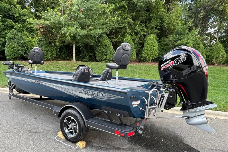 Slide: The Image of 2026 Ranger RT198P fishing boat with Mercury Pro XS engine, parked on a trailer. - 5