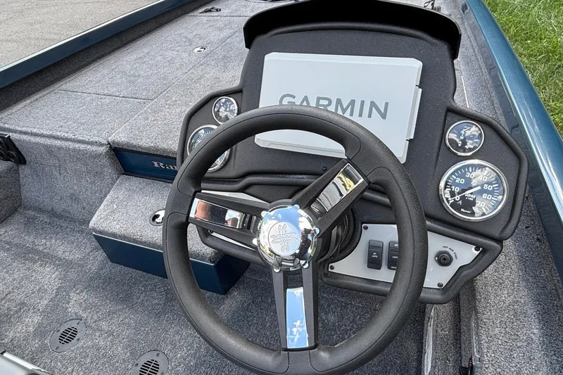 Slide: The Image of 2026 Ranger RT198P boat dashboard with Garmin display and steering wheel. - 8