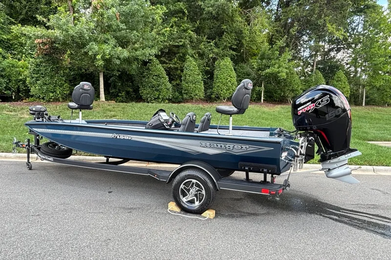 Slide: The Image of 2026 Ranger RT198P boat with Mercury Pro XS engine, parked on a road. - 4