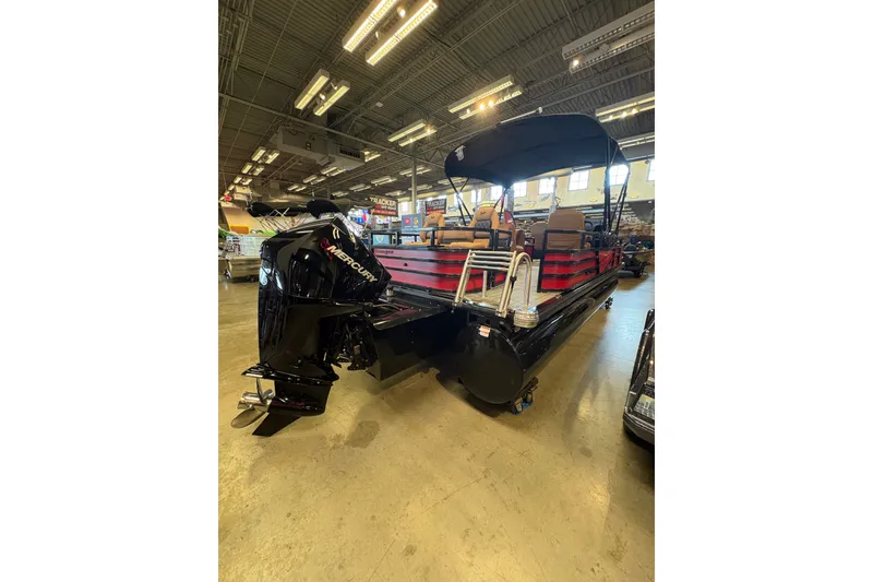 Slide: The Image of 2026 Ranger 223FC pontoon boat with Mercury engine in showroom. - 3