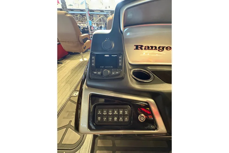 Slide: The Image of 2026 Ranger 223FC boat dashboard with control panel and audio system. - 17