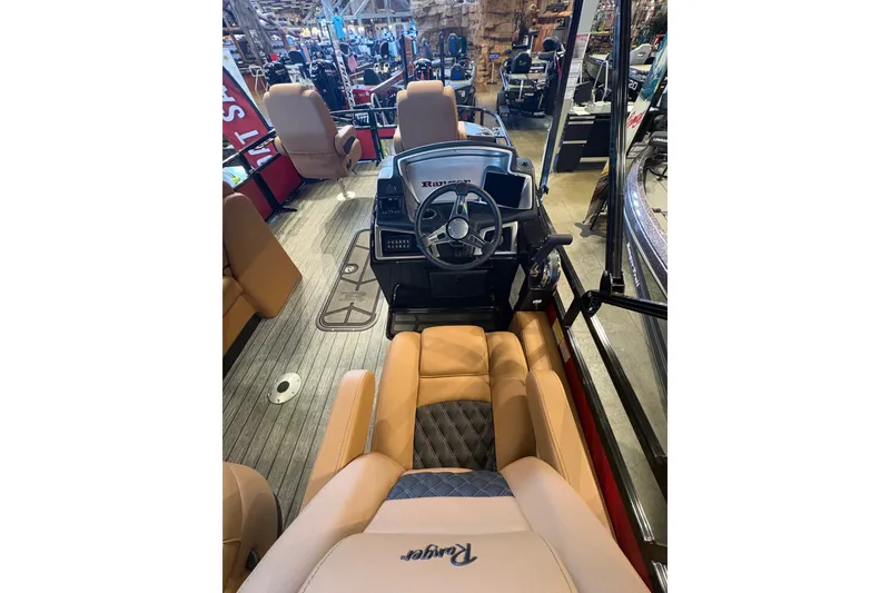 Slide: The Image of Interior view of 2026 Ranger 223FC boat with steering wheel and seating. - 15