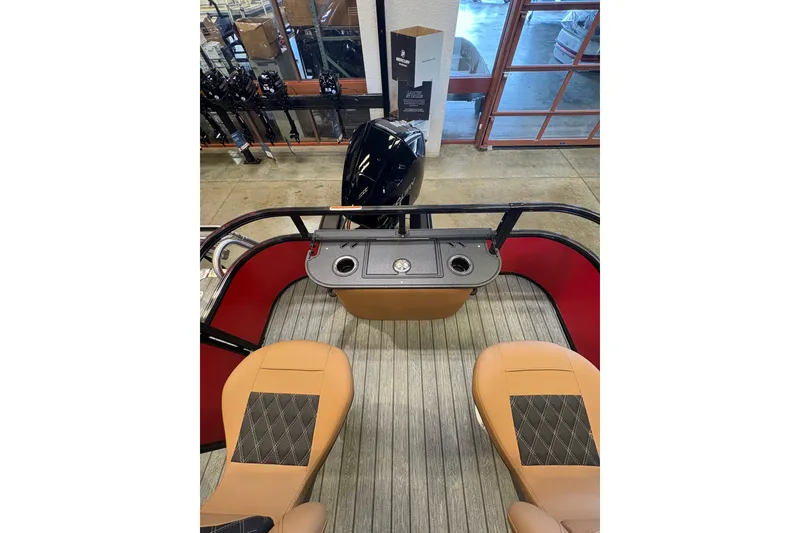 Slide: The Image of Interior view of 2026 Ranger 223FC boat with tan seats and control panel. - 8