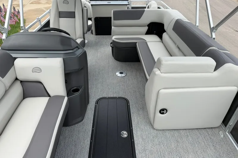 Slide: The Image of 2026 Sun Tracker Fishin' Barge 22 XP3 interior with spacious seating and modern design. - 17