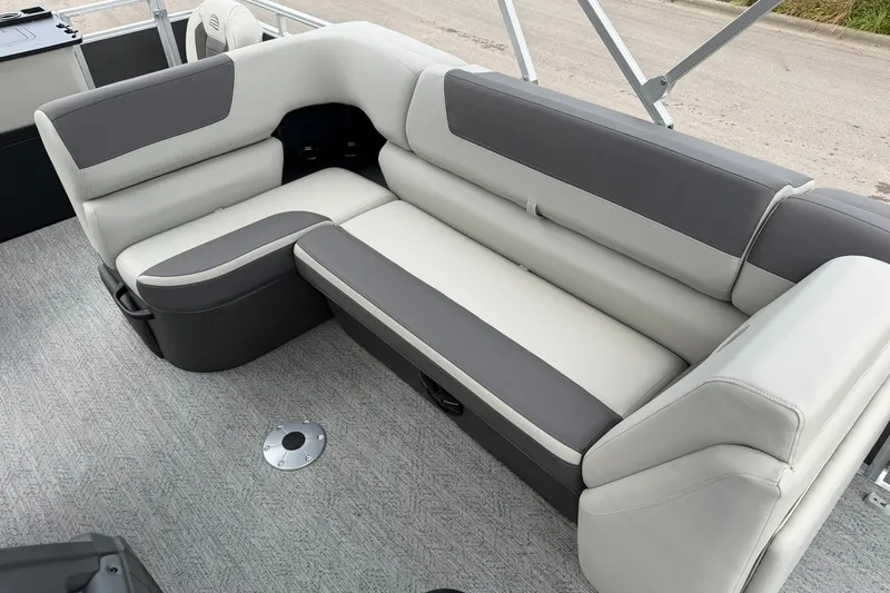 Slide: The Image of 2026 Sun Tracker Fishin' Barge 22 XP3 interior seating, featuring gray and white cushioned design. - 20