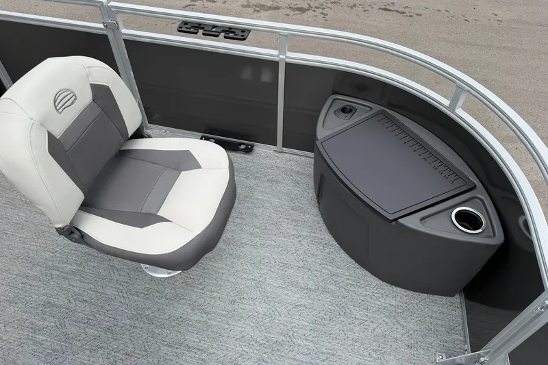 Slide: The Image of 2026 Sun Tracker Fishin' Barge 22 XP3 interior with seating and storage area. - 126