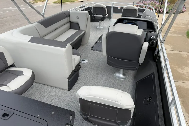Slide: The Image of 2026 Sun Tracker Fishin' Barge 22 XP3 interior with gray seating and modern design. - 27
